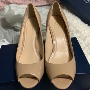Pair of nude 2 inch wedge heals, size 10 brand cole Haan